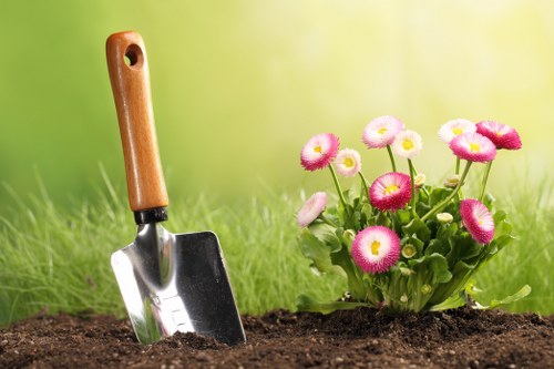 Landscape worker observing safety checks in the garden